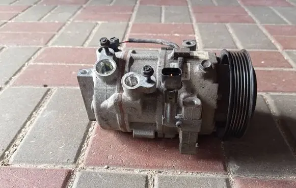 Hyundai Tucson TL Air conditioning (A/C) compressor (pump) 97701D7000