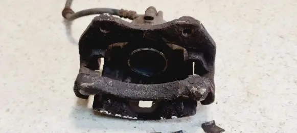 Nissan Almera N16 Front brake caliper