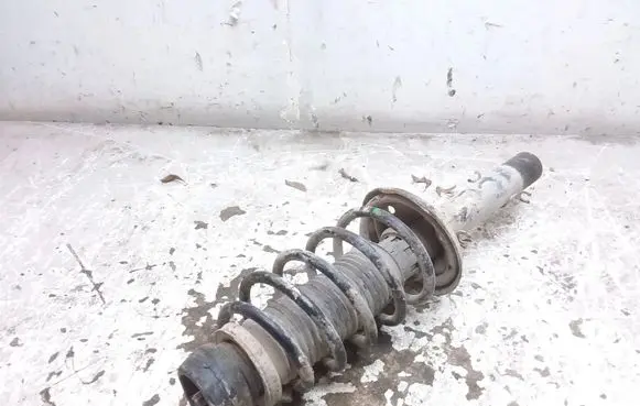 Volkswagen Golf IV Front shock absorber with coil spring 1J0413031AE