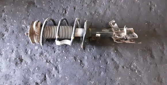 Front shock absorber with coil spring