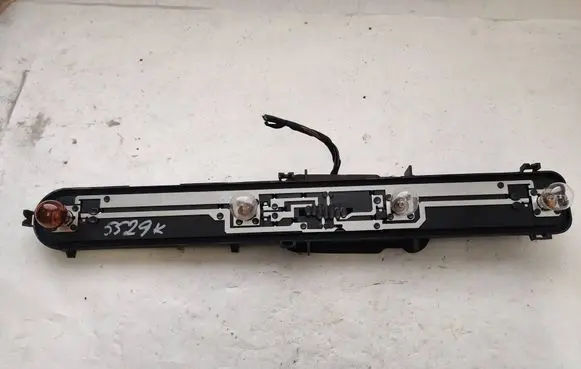 Tail light bulb cover holder