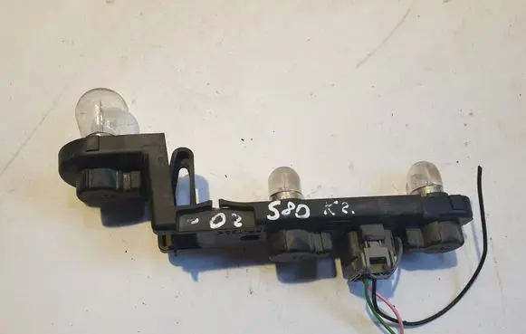 Tail light bulb cover holder