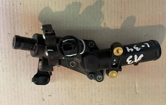 Thermostat/thermostat housing