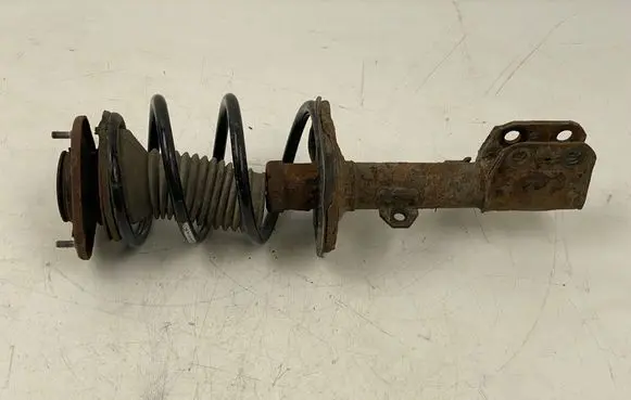 Front shock absorber with coil spring