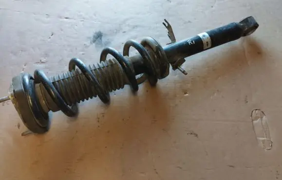 Infiniti G37 Front shock absorber with coil spring 56110JJ52A