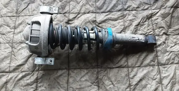 Volkswagen Touareg I Rear shock absorber with coil spring 7L6513029E