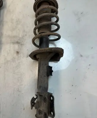 Suzuki Swift I Front shock absorber with coil spring 321213