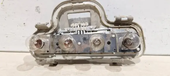 Tail light bulb cover holder