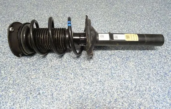 Volkswagen Golf VII Front shock absorber with coil spring 5Q0412014ME
