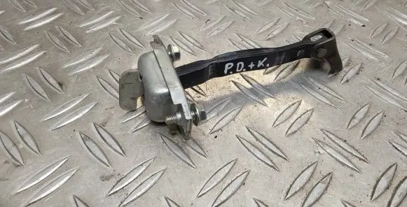 Front door check strap stopper