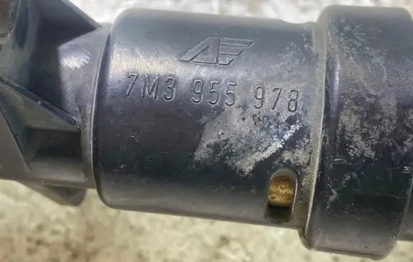 Headlight washer spray nozzle