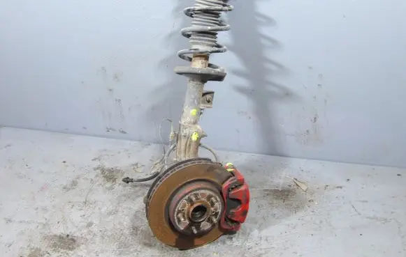 Suzuki Grand Vitara II Front shock absorber with coil spring