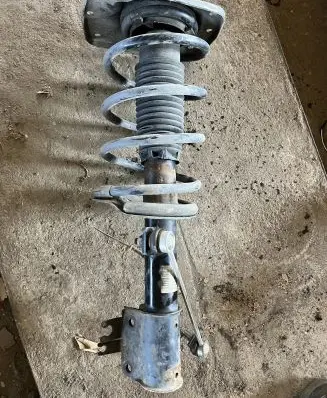 Front shock absorber with coil spring