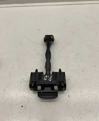 Front door check strap stopper