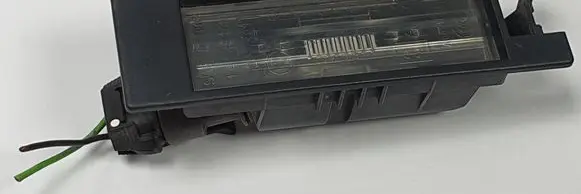 Opel Corsa D Number plate light 13139990