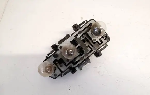 Tail light bulb cover holder