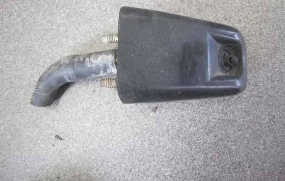 Mitsubishi Pajero Sport I Headlight washer nozzle holder 