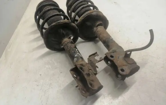 Nissan Almera N16 Front shock absorber with coil spring