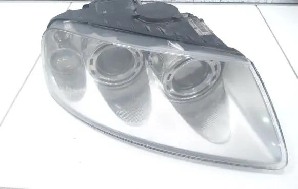 Volkswagen Touareg I Headlight/headlamp 7L6941016