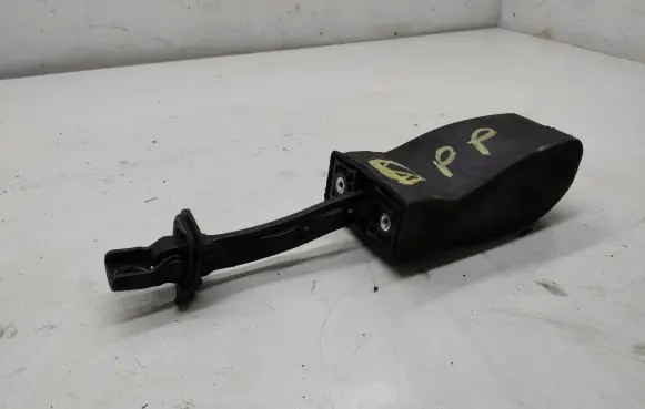 Front door check strap stopper