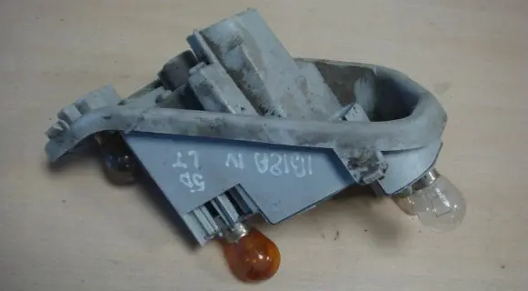 Tail light bulb cover holder