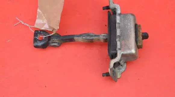 Cadillac CTS Front door check strap stopper 25680448