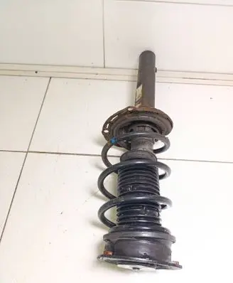 Volkswagen Golf VII Front shock absorber with coil spring 5Q0413023FK 5Q0413023
