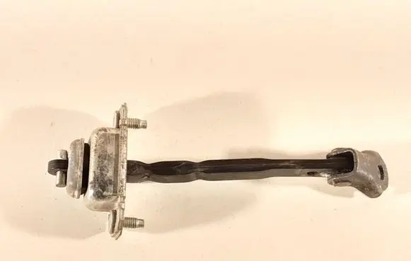 Subaru Impreza III Rear door check strap stopper