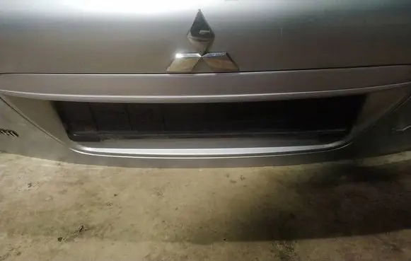 Mitsubishi Lancer X Trunk door license plate light bar 
