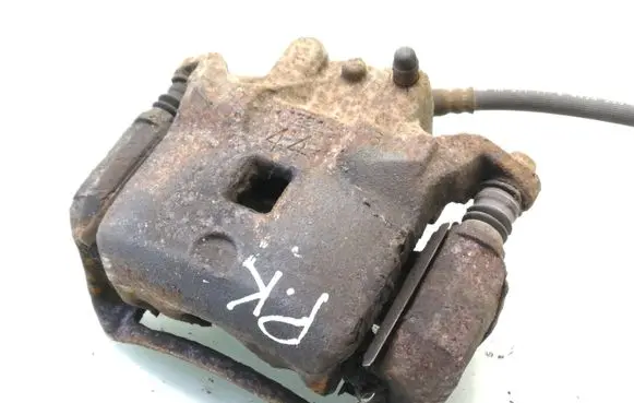 Nissan Juke I F15 Front brake caliper
