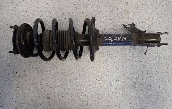 Nissan Almera N16 Front shock absorber with coil spring 