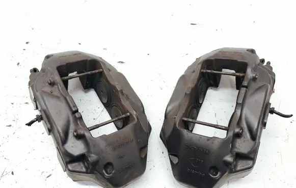 Volkswagen Touareg II Front brake caliper 7P6615105AF 7P6615106AF 209236065A