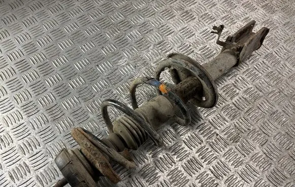 Dacia Logan I Front shock absorber with coil spring