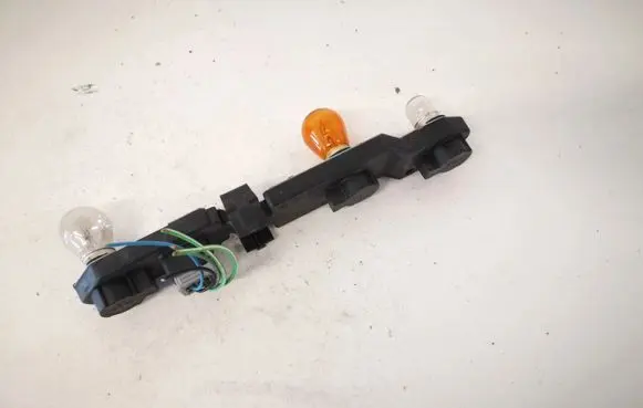 Tail light bulb cover holder
