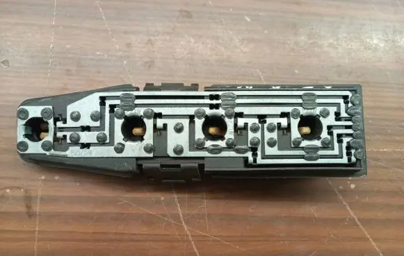 Tail light bulb cover holder