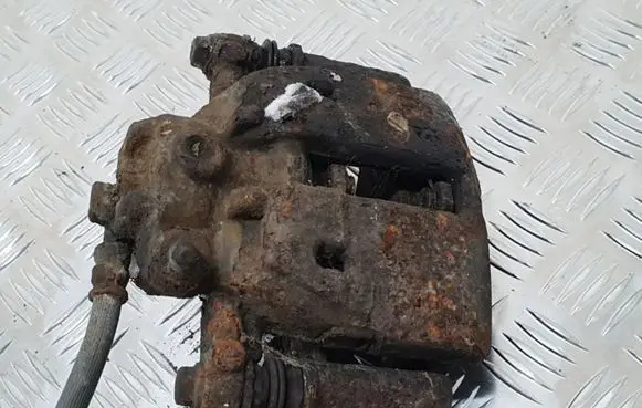 Mitsubishi Colt Front brake caliper 323251545