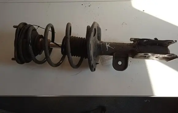Front shock absorber with coil spring