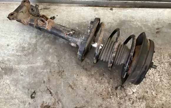 Front shock absorber with coil spring