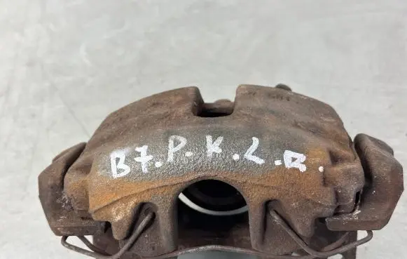 Volkswagen PASSAT B7 Front brake caliper 1K0615123