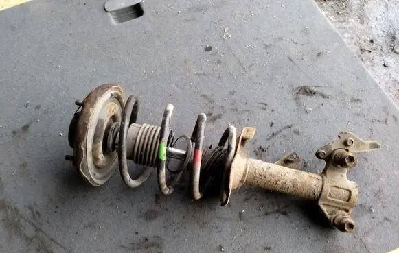 Nissan Primera Front shock absorber with coil spring
