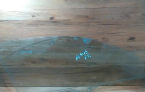 Mazda 323 Front door window glass four-door