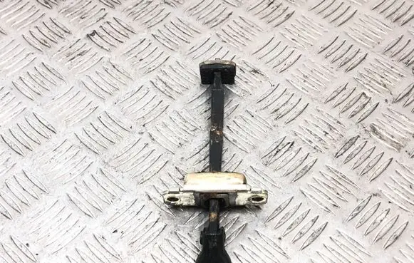 Front door check strap stopper