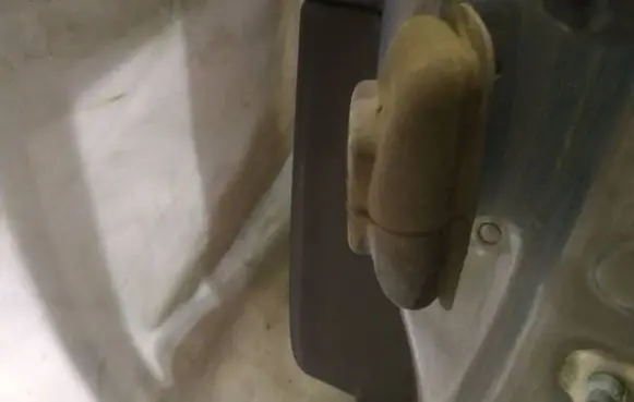 Rear door check strap stopper
