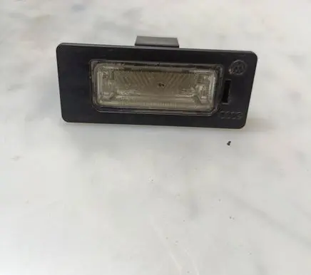 Volkswagen PASSAT B6 Number plate light 810943021