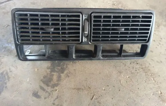 Volkswagen Golf IV Dash center air vent grill 1J0819734B