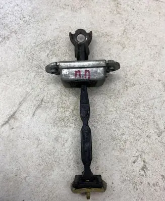 Front door check strap stopper