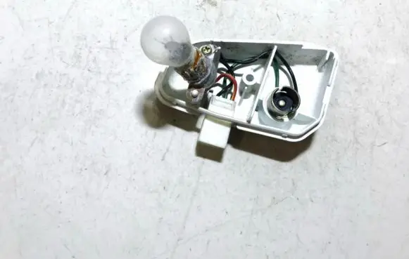 Mazda 626 Tail light bulb cover holder