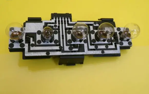 Tail light bulb cover holder