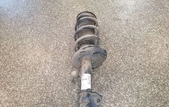 Front shock absorber with coil spring