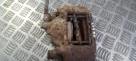 Mazda 323 F Front brake caliper